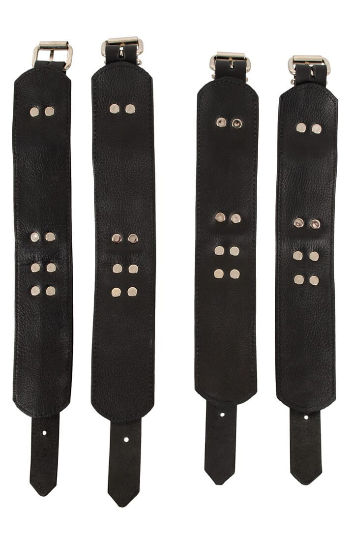Wrist and ankle restraints shown from the back with buckled leather straps
