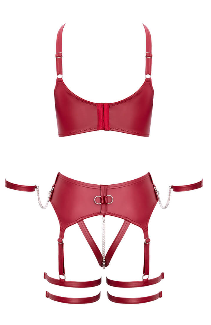 Flat lay of erotic lingerie set with bra, thong, and cuffs - COAX Copenhagen fetishwear
