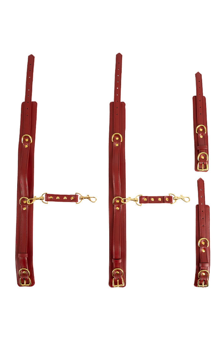 Adjustable wrist cuffs and thigh cuffs set in red faux leather, gold details