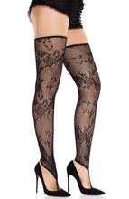 Load image into Gallery viewer, Black toe loop stockings with floral lace design - styled with heels