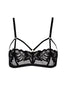 Close-up of COAX Copenhagen’s black bralette with cage straps and adjustable golden hardware