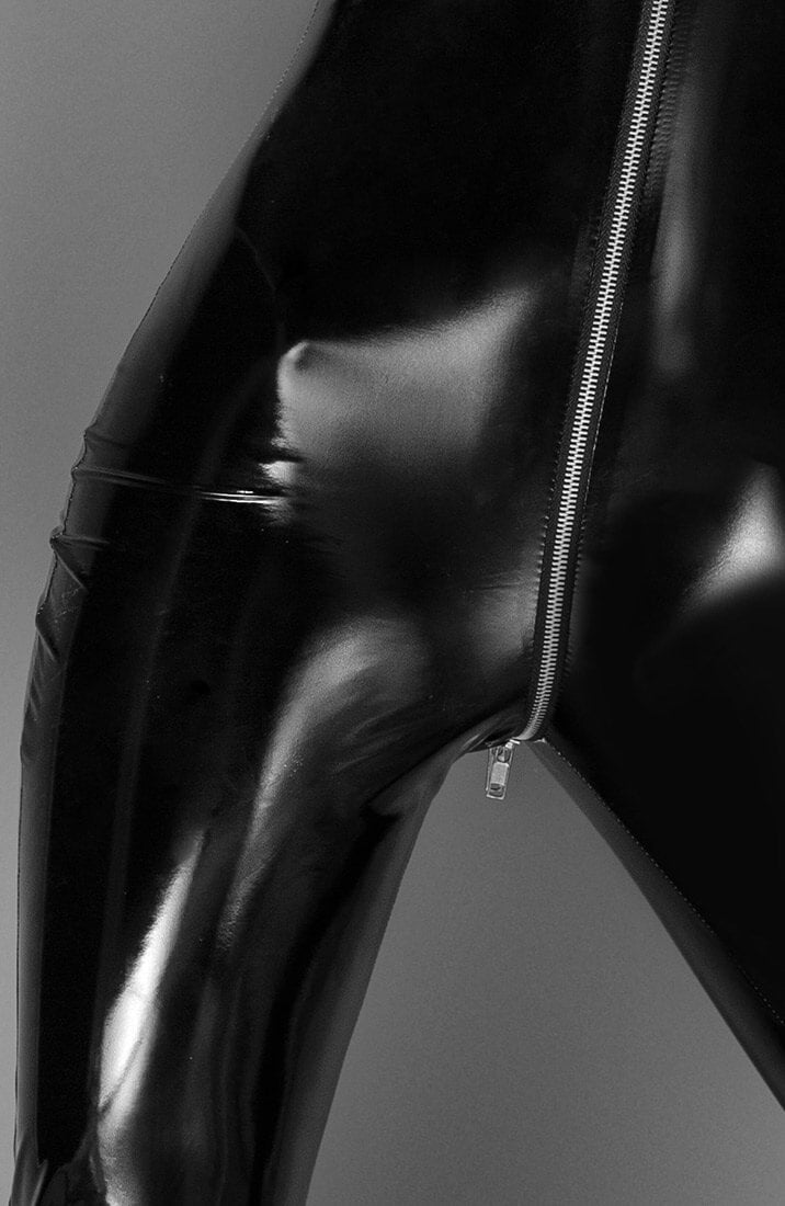 Step into your power with this sculpting black PVC catsuit, featuring a bold 3-way zip for a commanding Domina look