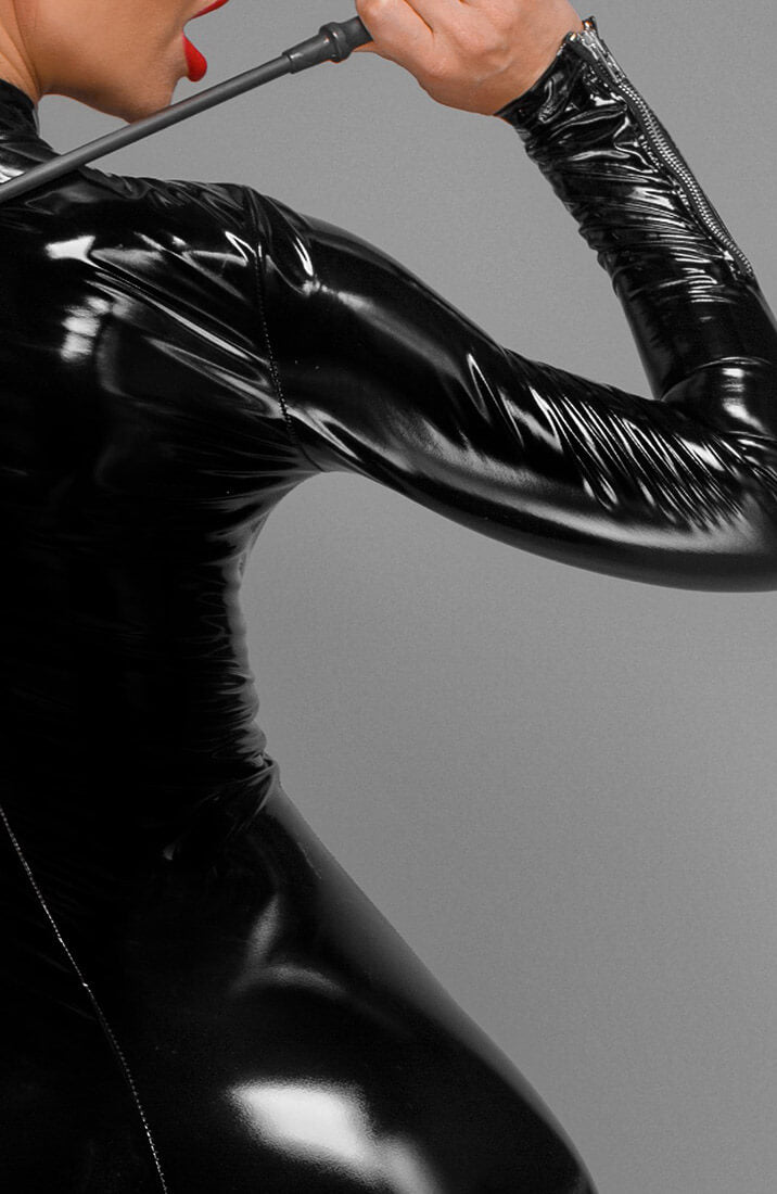 Sleek, high-gloss PVC catsuit with a statement 3-way zip - made for those who love control and seduction