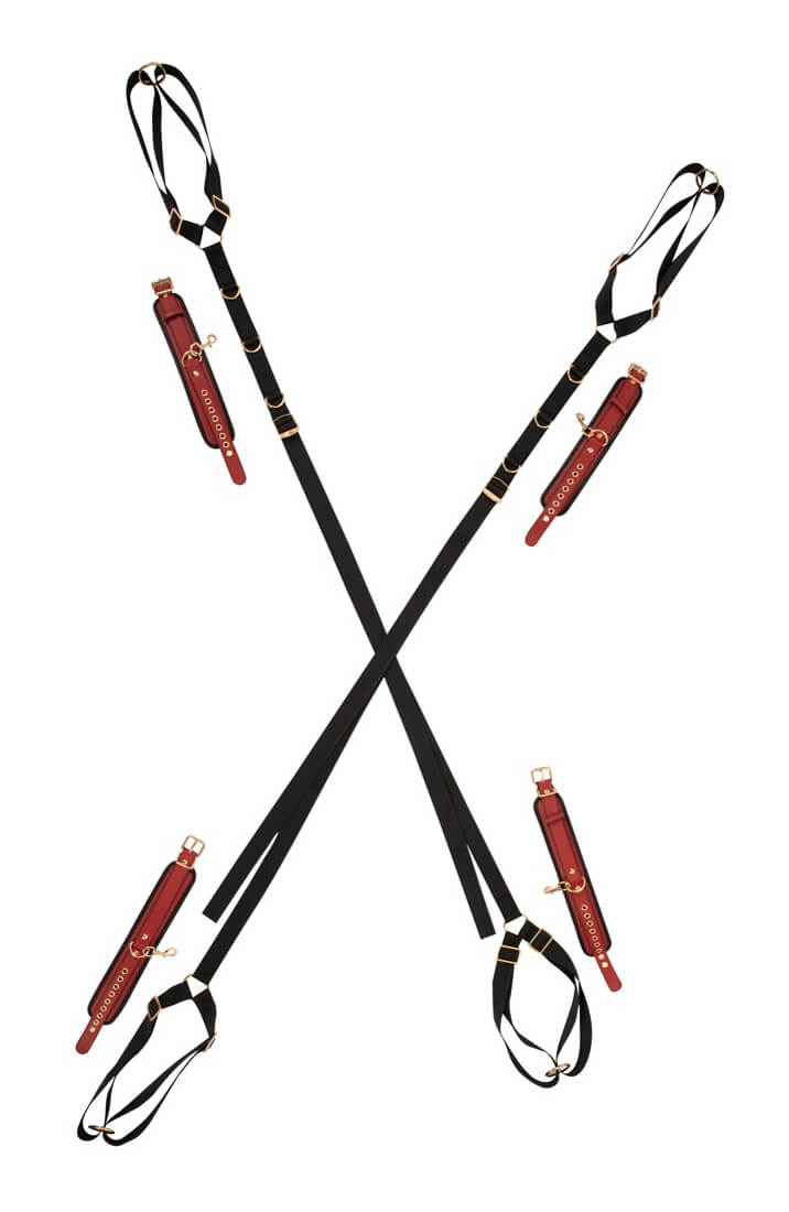 Black X-shaped door and bed restraint strap system with four burgundy cuffs