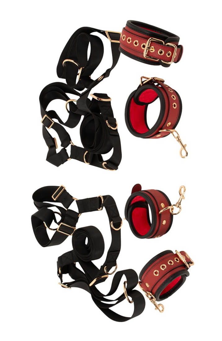 1. Four burgundy padded restraint cuffs with gold-tone buckles and snap hooks