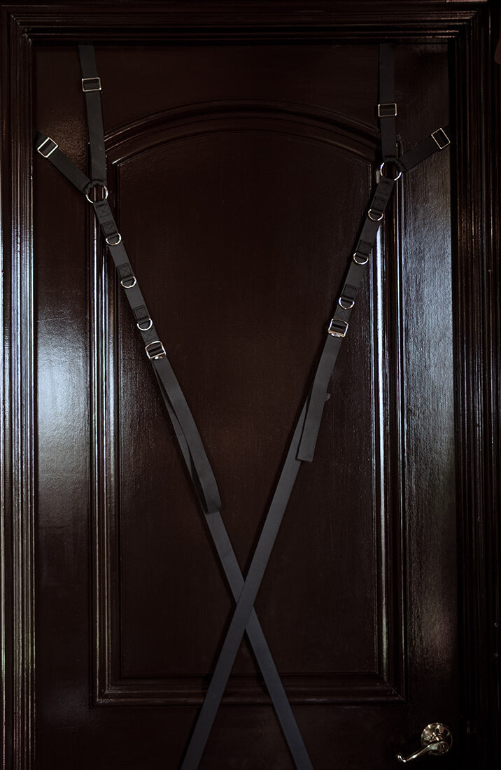 Burgundy cuffs with adjustable black door restraint straps