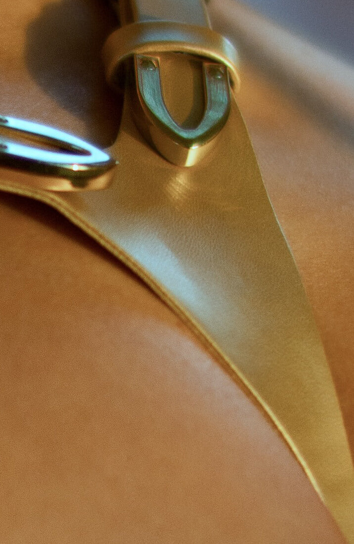 COAX Copenhagen gold harness teddy with leather-look straps and draped chains