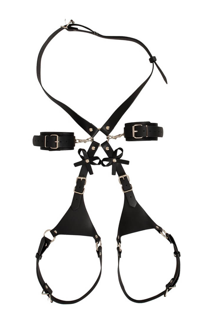 Black strappy hip harness with detachable cuffs, buckles and bow details