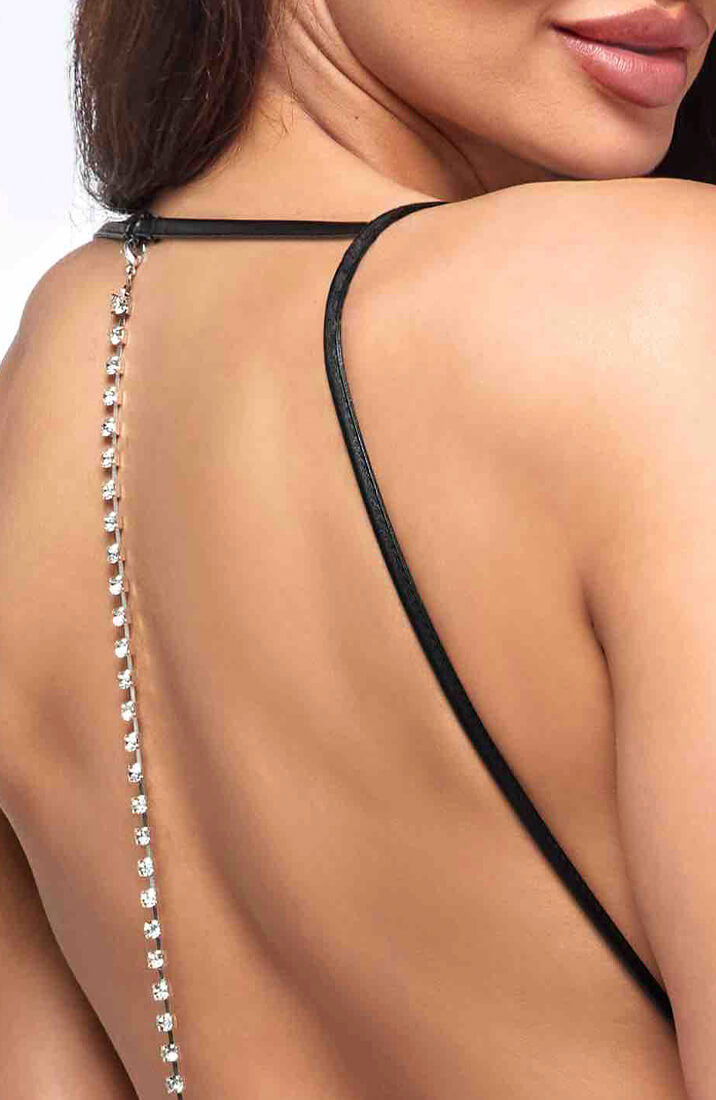 Figure-hugging wet look catsuit with crystal rhinestone detailing on the open back – high-impact glamour